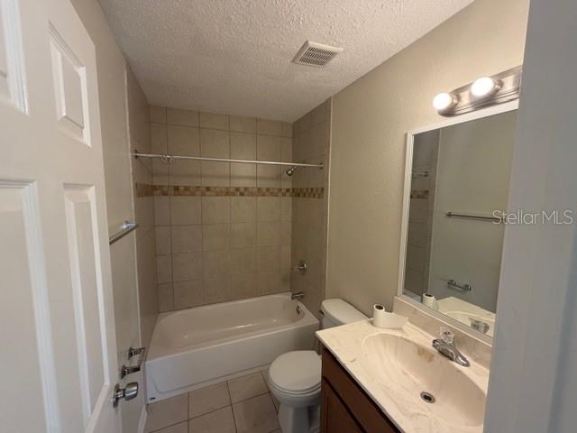 11089 Pendleton Avenue, Unit B Englewood, FL 34224 - Photo 17 of 19 a bathroom with a sink a toilet a mirror a bathtub and shower