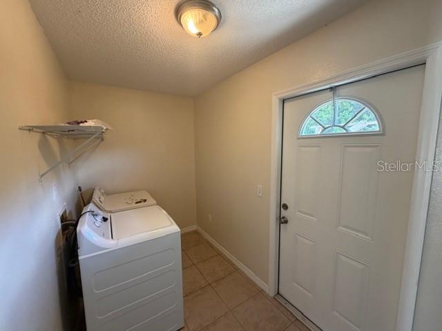 11089 Pendleton Avenue, Unit B Englewood, FL 34224 - Photo 18 of 19 a utility room with dryer and washer