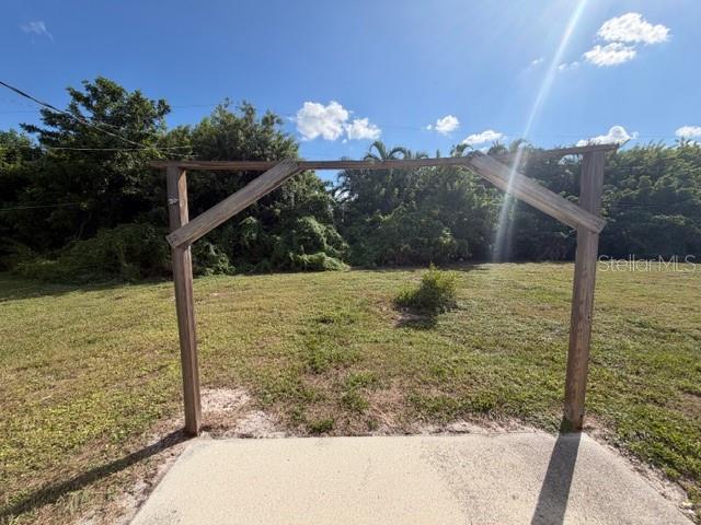 11089 Pendleton Avenue, Unit B Englewood, FL 34224 - Photo 19 of 19 a view of a pathway both side of building