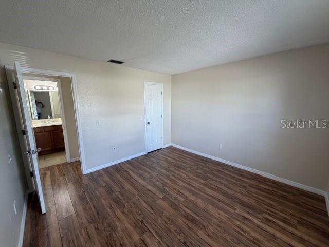 11089 Pendleton Avenue, Unit B Englewood, FL 34224 - Photo 9 of 19 wooden floor in an empty room