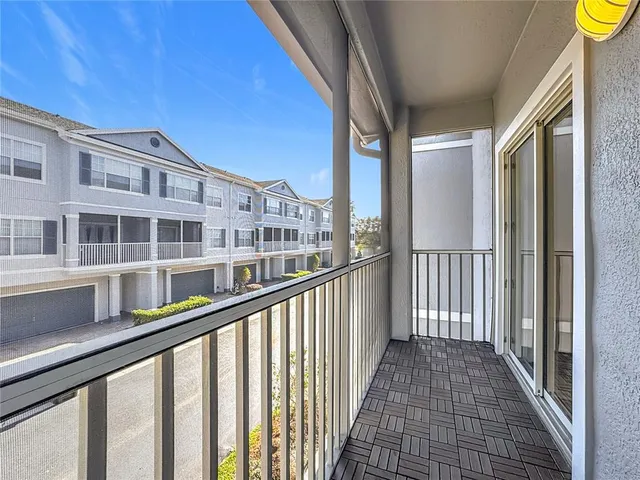 a kitchen with stainless steel appliances granite countertop a refrigerator a stove and a sink