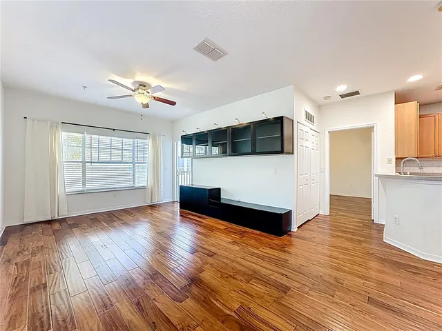 a kitchen with stainless steel appliances a refrigerator sink and microwave
