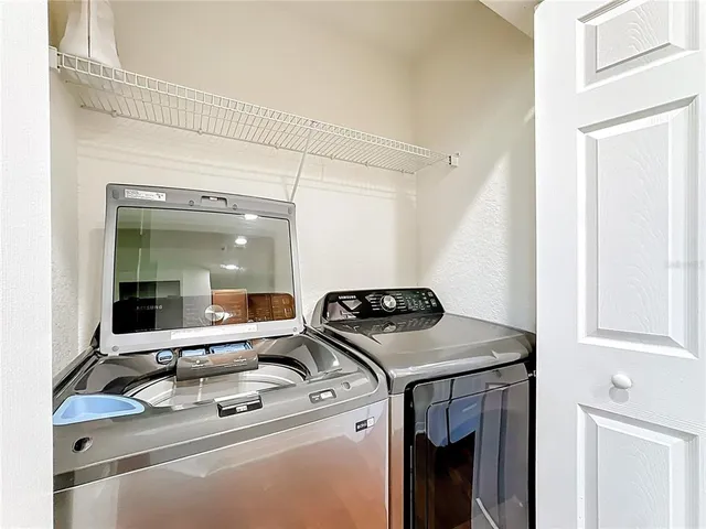 a bathroom with a sink toilet a mirror and shower