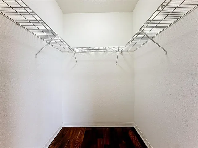 an aerial view of residential building with outdoor space and trees