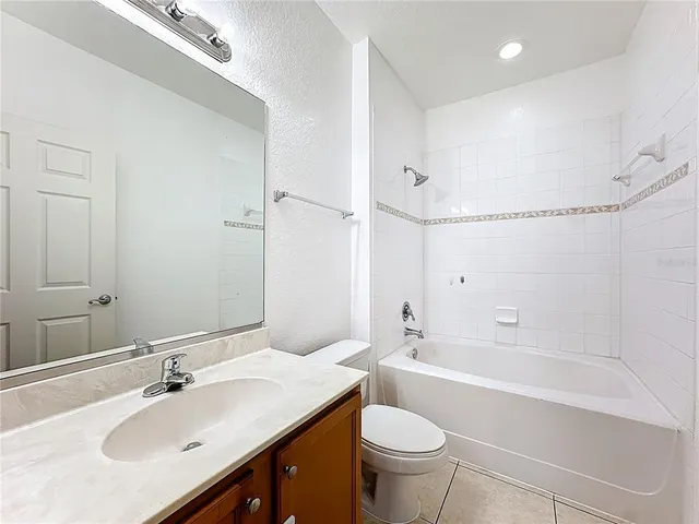 a view of a swimming pool with lounge chairs