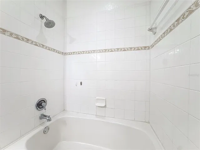 a view of a room with lots of green space and lots of shelves