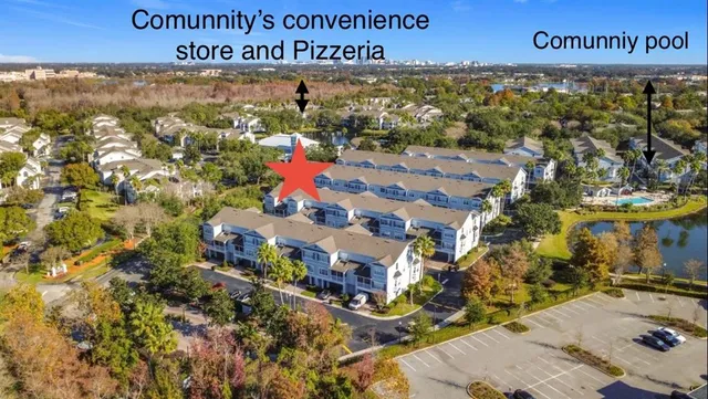 a view of kitchen and hall with wooden floor
