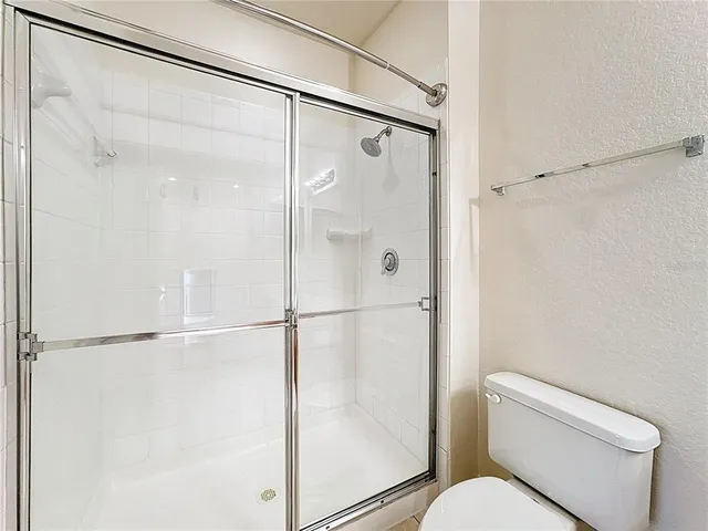 an aerial view of residential houses with city view