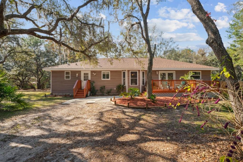 11185 Cleever Street Weeki Wachee, FL 34614 - Photo 57 of 57 front view of house with a yard