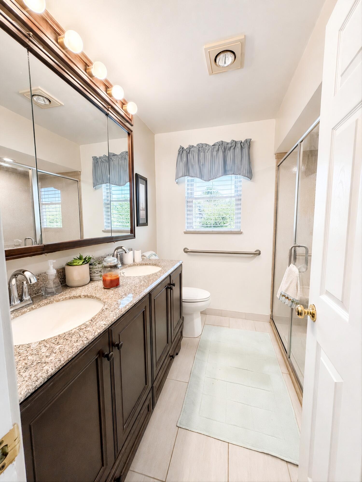 108 Beverly Place Munster, IN 46321 - Photo 21 of 47 a bathroom with a granite countertop sink mirror vanity and a bathtub