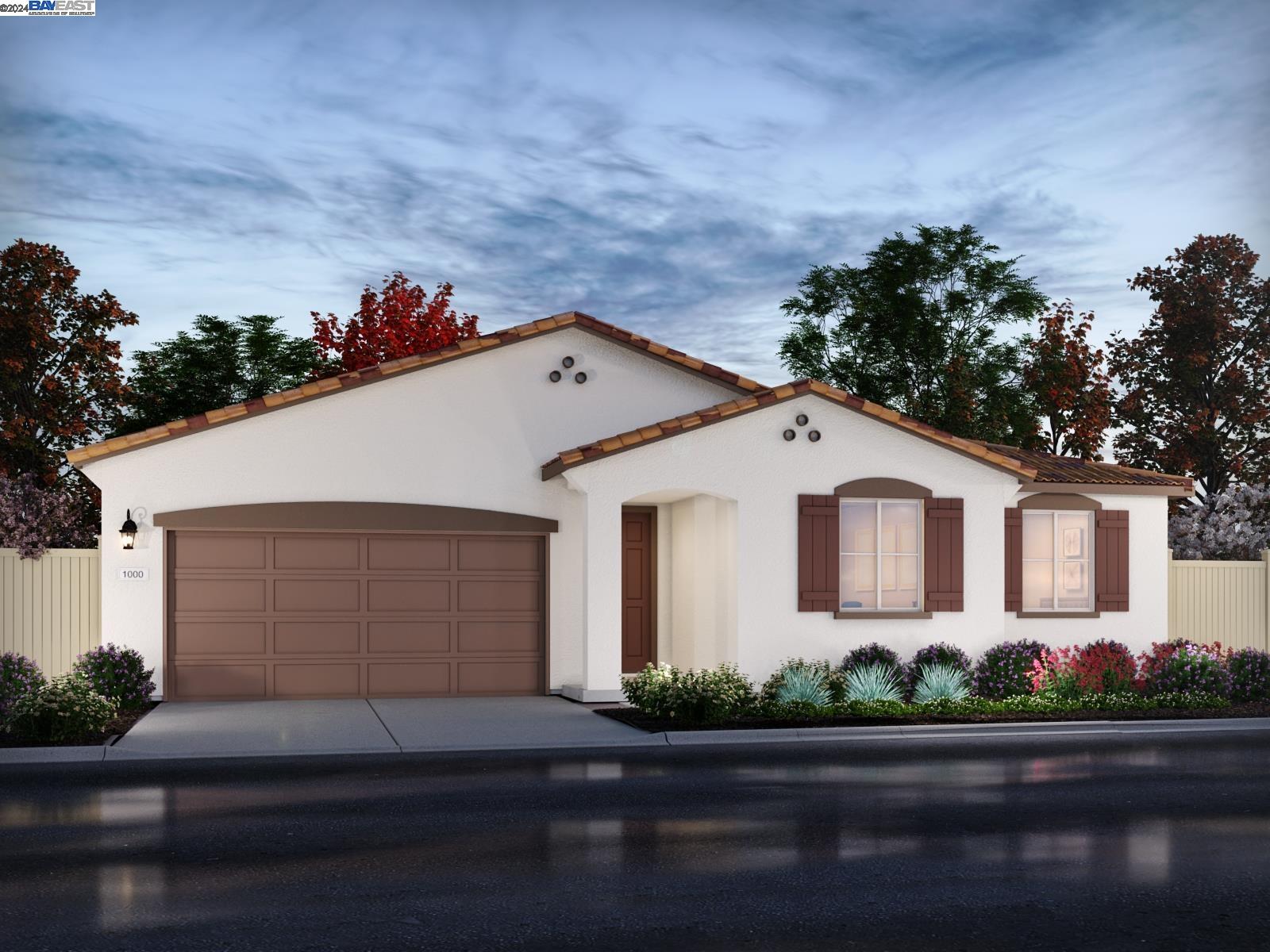 1618 Eagle River Avenue Manteca, CA 95337 - Photo 1 of 1 a front view of a house with garage and plants