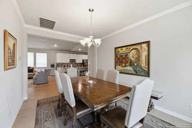 a kitchen with counter top space a sink appliances and cabinets