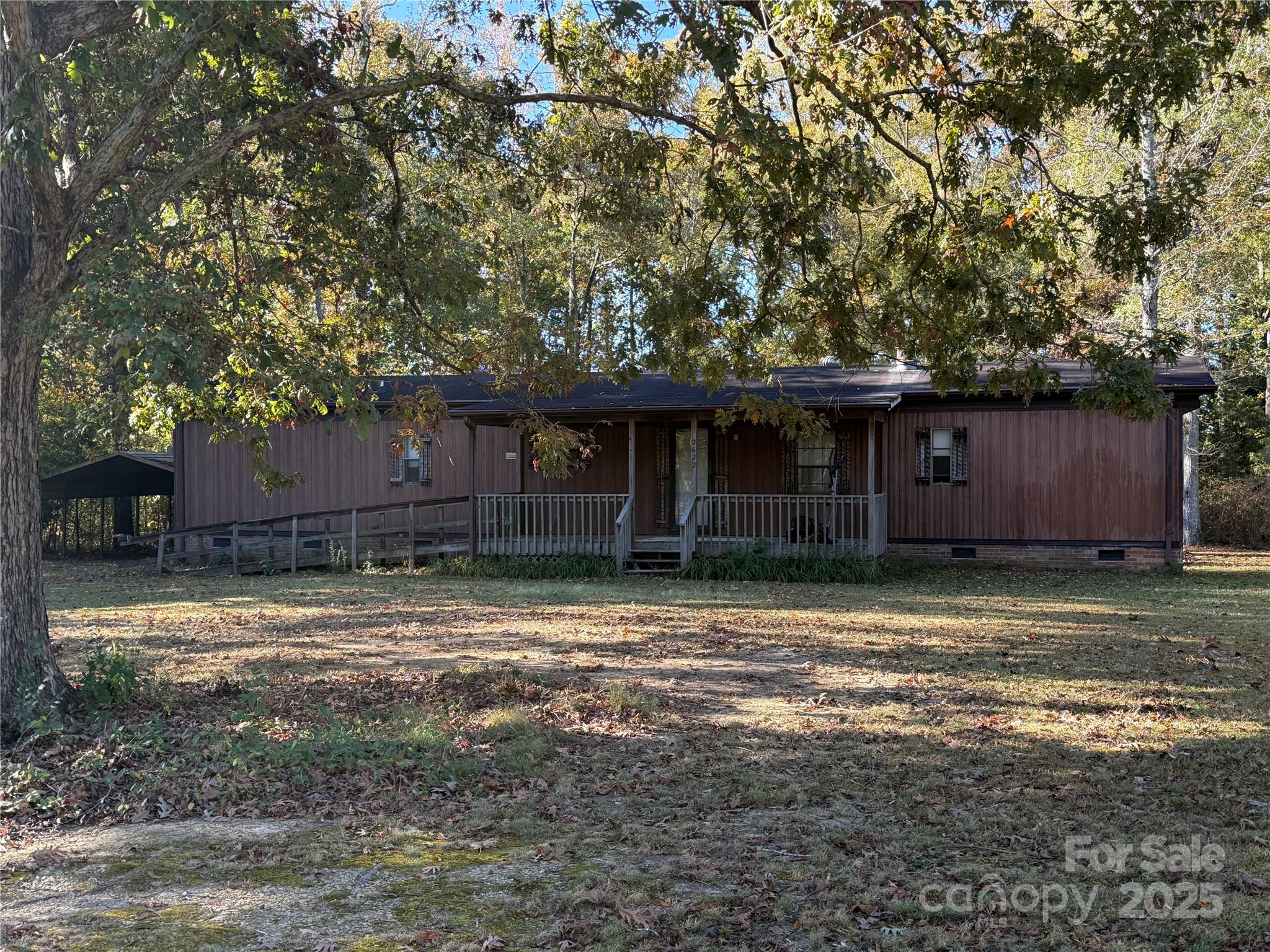 2622 Cimarron Circle Midland, NC 28107 - Photo 1 of 13 a front view of a house with a yard