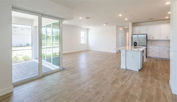 a room with furniture and wooden floor