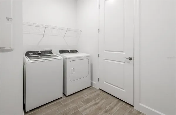 a view of a storage & utility room with washer and dryer