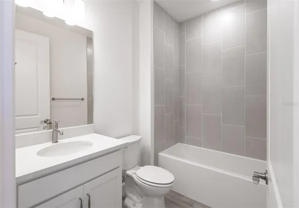 a bathroom with a sink toilet and a bathtub
