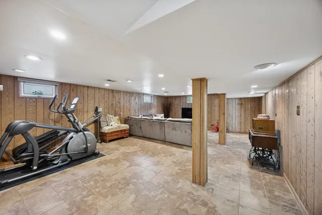 a kitchen that has a sink a refrigerator and a stove