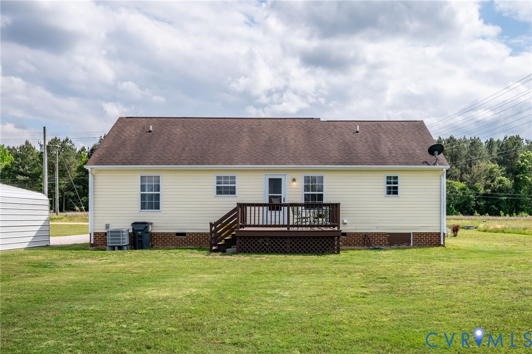 5280 West Quaker Road Disputanta, VA 23875 - Photo 13 of 33 a front view of house with yard and car parked