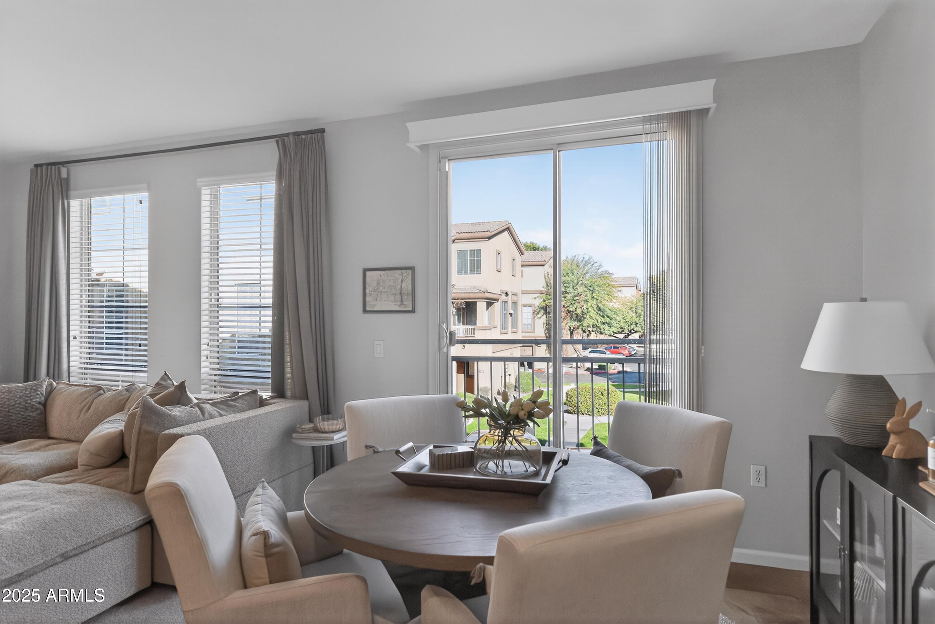 1920 East Bell Road, Unit 1079 Phoenix, AZ 85022 - Photo 16 of 29 a living room with furniture and a large window