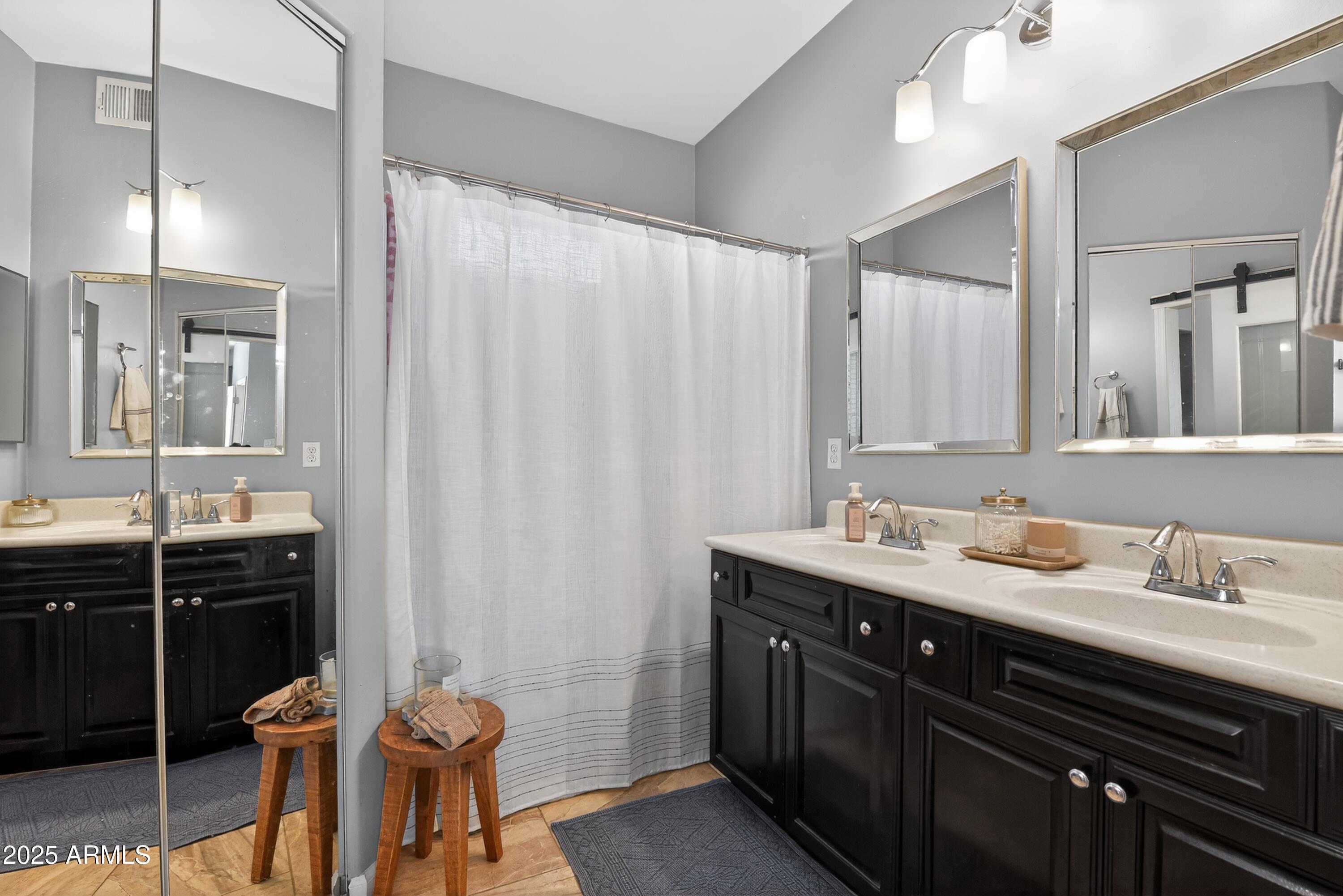 1920 East Bell Road, Unit 1079 Phoenix, AZ 85022 - Photo 24 of 29 a bathroom with a sink and a mirror