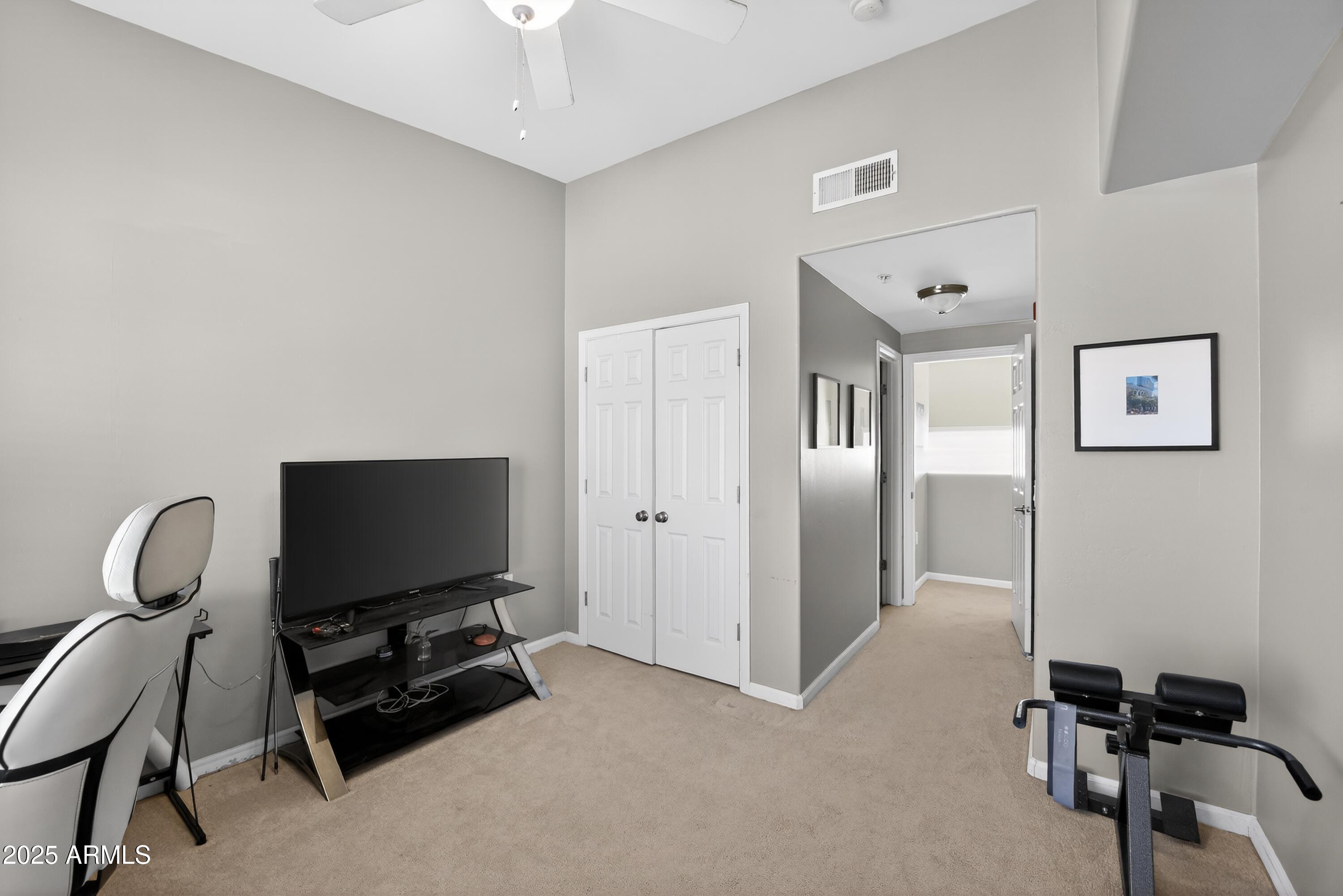1920 East Bell Road, Unit 1079 Phoenix, AZ 85022 - Photo 29 of 29 a view of a workspace with furniture and a flat screen tv
