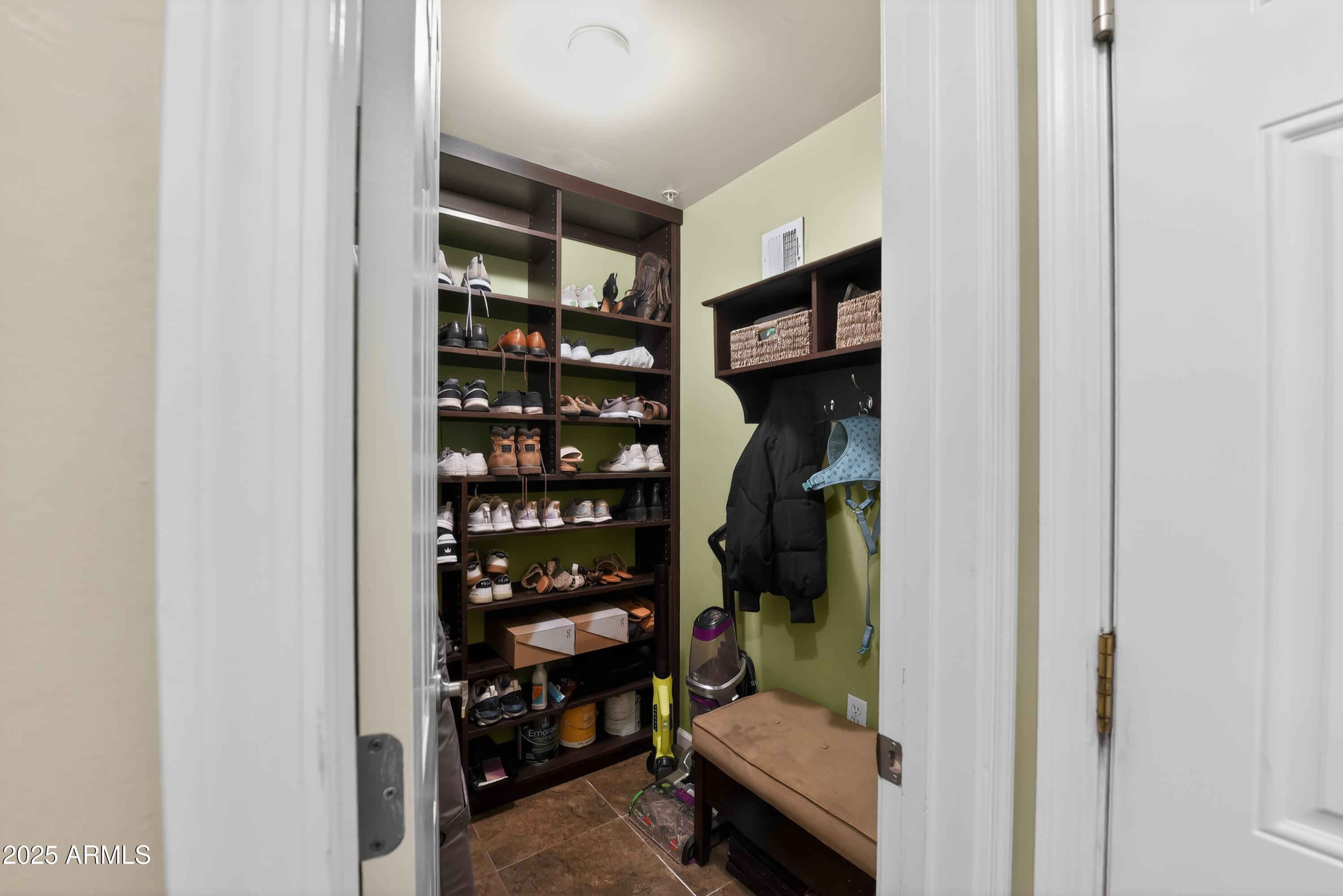 1920 East Bell Road, Unit 1079 Phoenix, AZ 85022 - Photo 6 of 29 a view of walk in closet with clothes and shoes