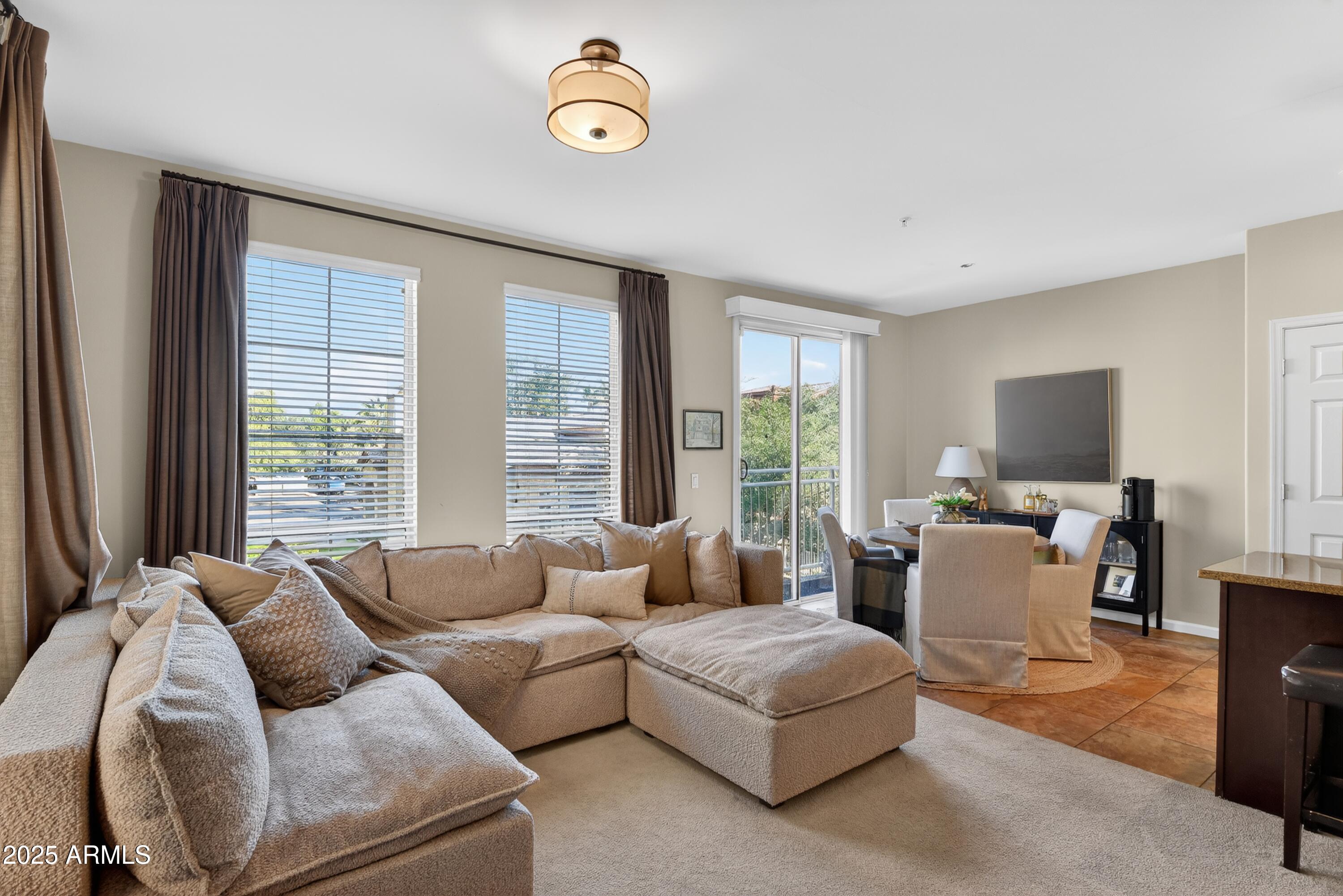 1920 East Bell Road, Unit 1079 Phoenix, AZ 85022 - Photo 9 of 29 a living room with furniture and a large window