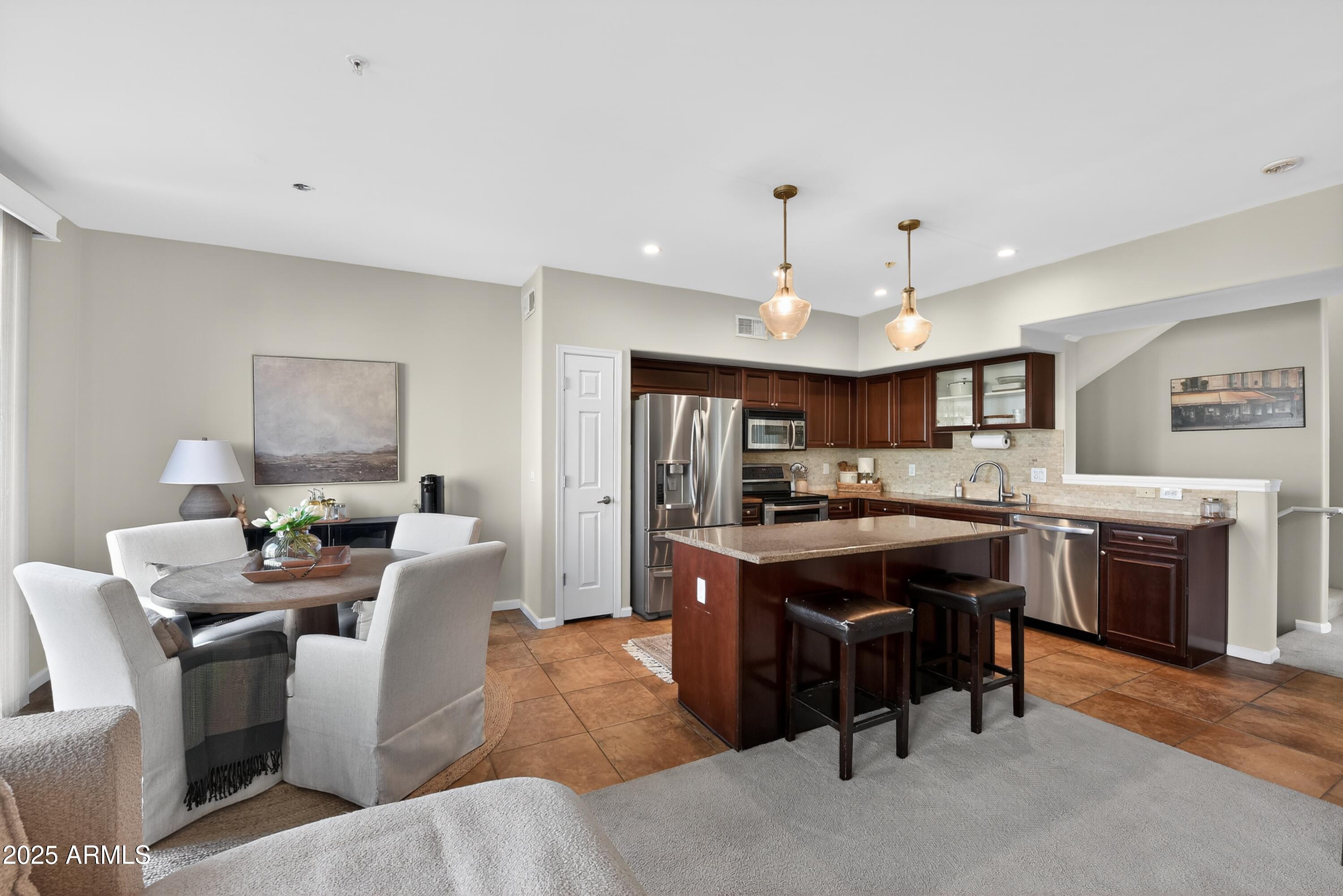 1920 East Bell Road, Unit 1079 Phoenix, AZ 85022 - Photo 10 of 29 a view of a dining room with furniture
