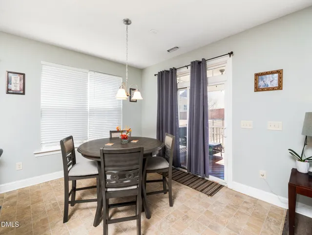 a kitchen with granite countertop a sink stove and cabinets
