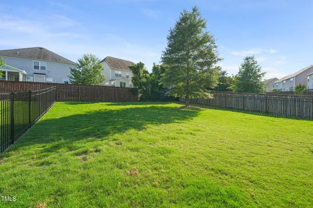 a view of a swimming pool with a yard