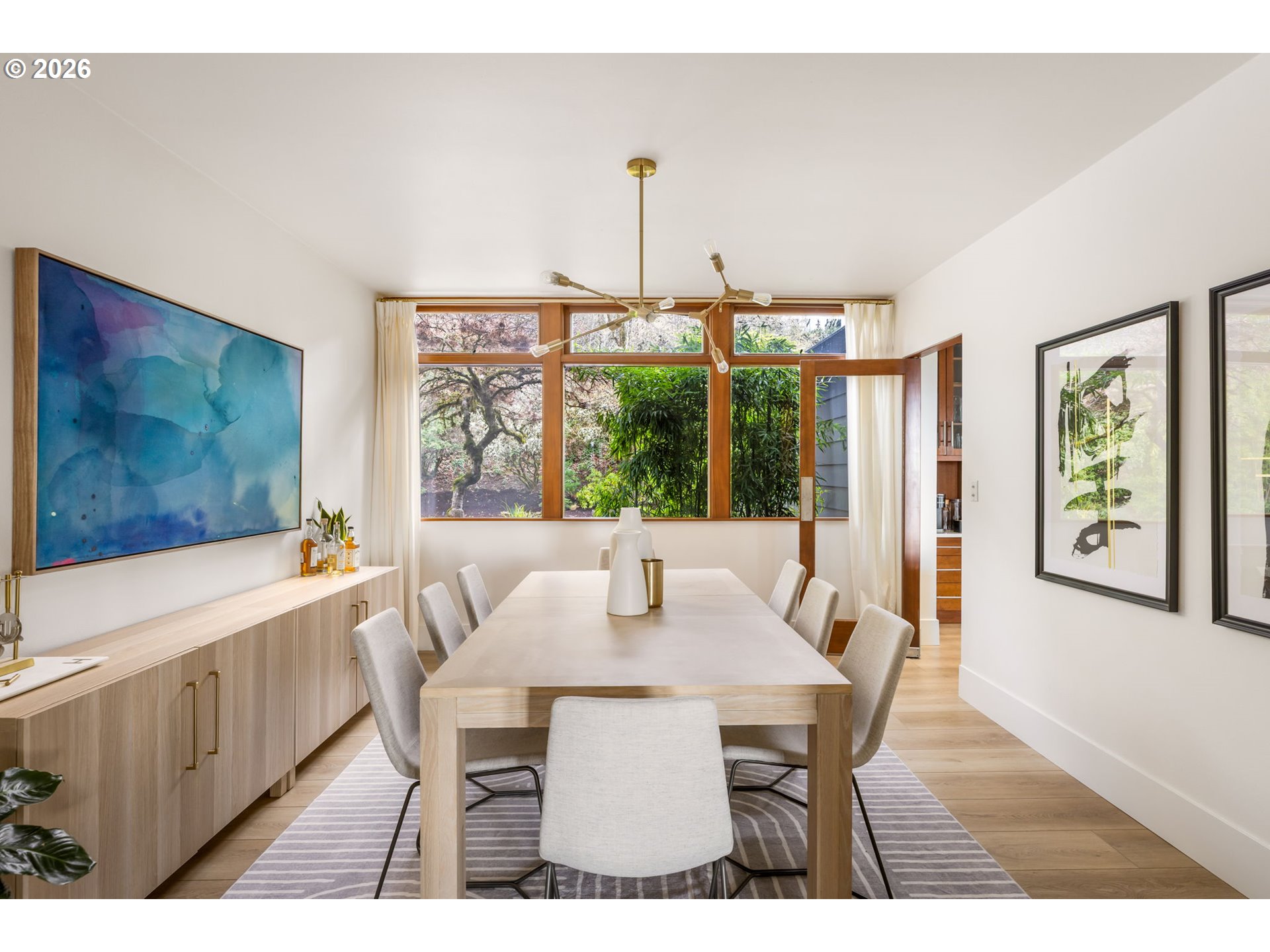 400 Northwest Miller Road Portland, OR 97229 - Photo 18 of 48 a view of a dining room with furniture large window and wooden floor