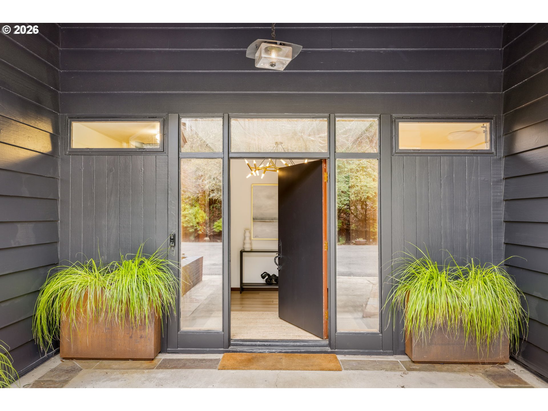 400 Northwest Miller Road Portland, OR 97229 - Photo 3 of 48 a view of a porch with furniture and a yard