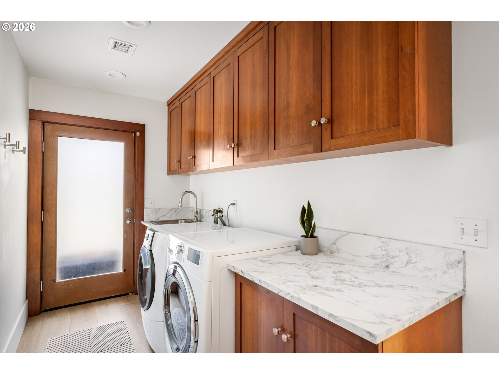 400 Northwest Miller Road Portland, OR 97229 - Photo 33 of 48 a kitchen with a sink a stove and cabinets