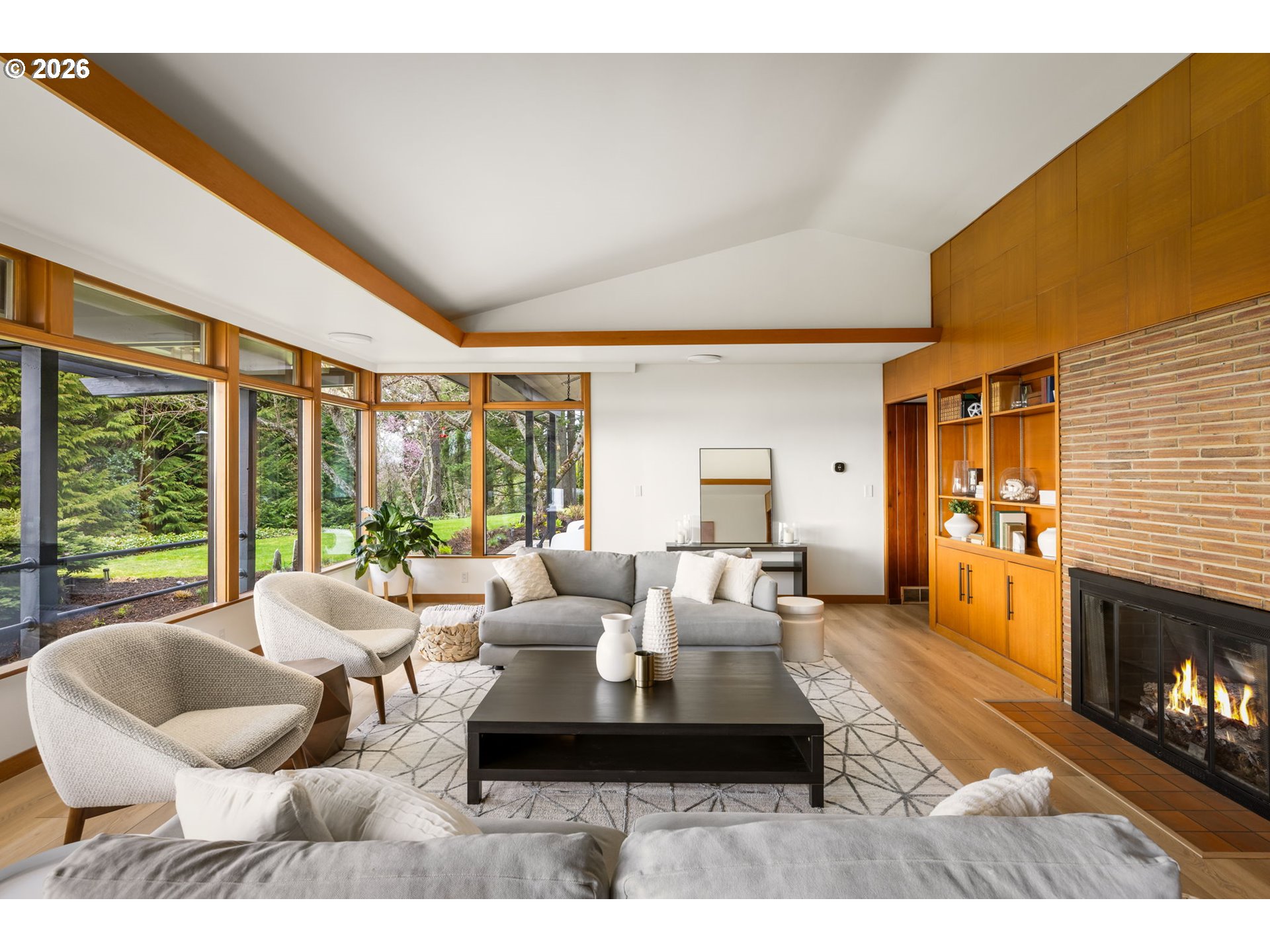 400 Northwest Miller Road Portland, OR 97229 - Photo 8 of 48 a living room with furniture large window and a fireplace
