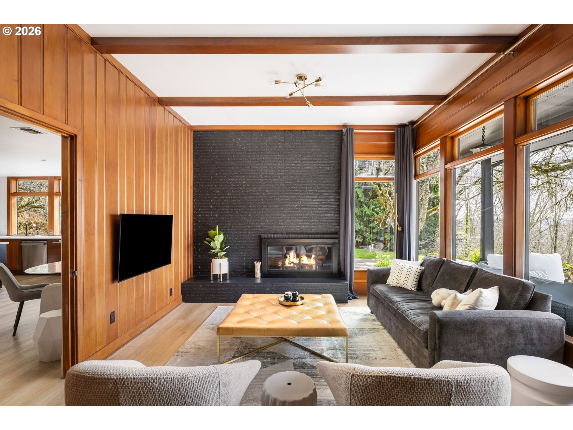 400 Northwest Miller Road Portland, OR 97229 - Photo 10 of 48 a living room with furniture a large window and a flat screen tv