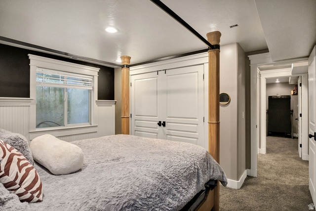 288 525 South Providence, UT 84332 - Photo 33 of 71 Recessed lighting illuminates this room featuring white wainscoting, a window with white blinds, and a built-in closet with white panel doors and black hardware
