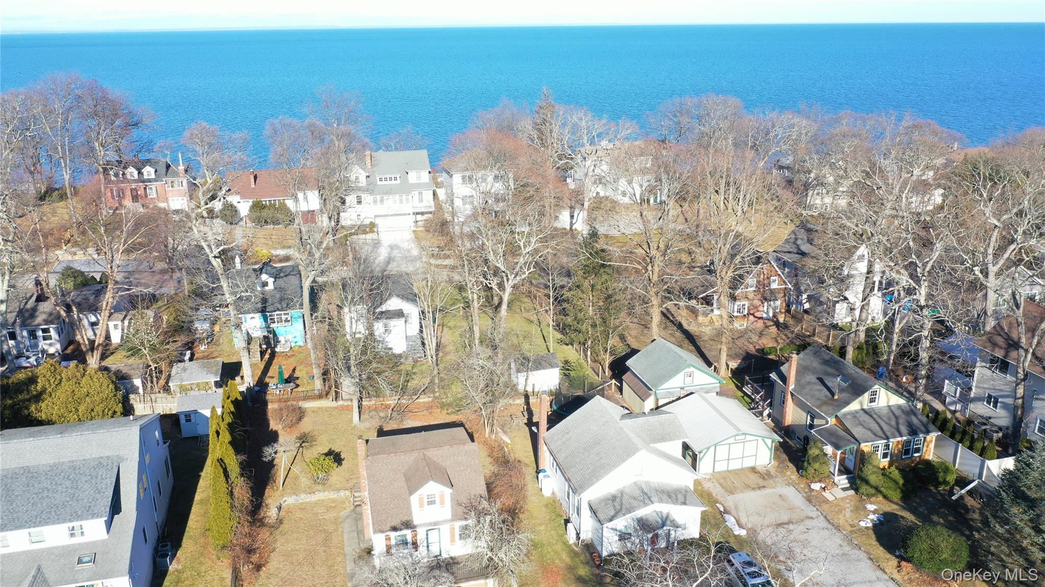 84 Cedar Road Wading River, NY 11792 - Photo 3 of 17 Aerial perspective of suburban area with a large body of water