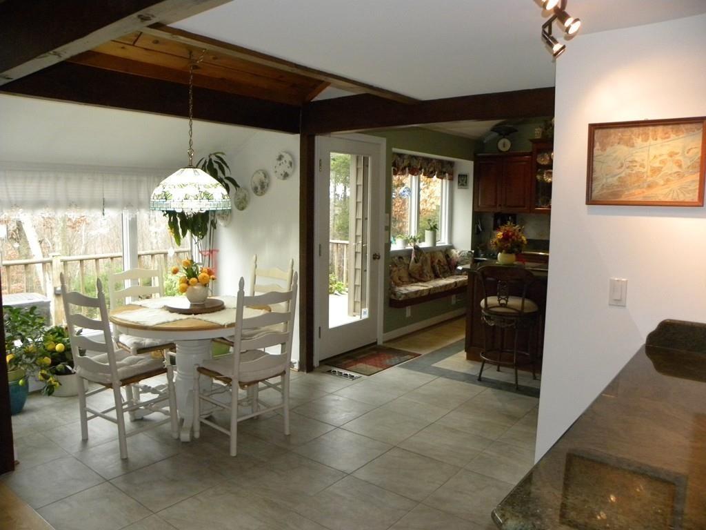 101 Vinton Road Holland, MA 01521 - Photo 12 of 42 a view of a dining room with furniture and chandelier