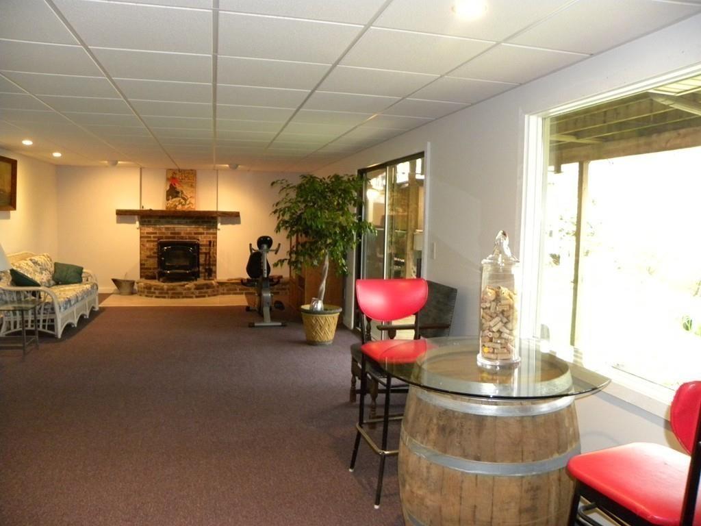 101 Vinton Road Holland, MA 01521 - Photo 14 of 42 a view of a livingroom with furniture a fireplace and a chandelier