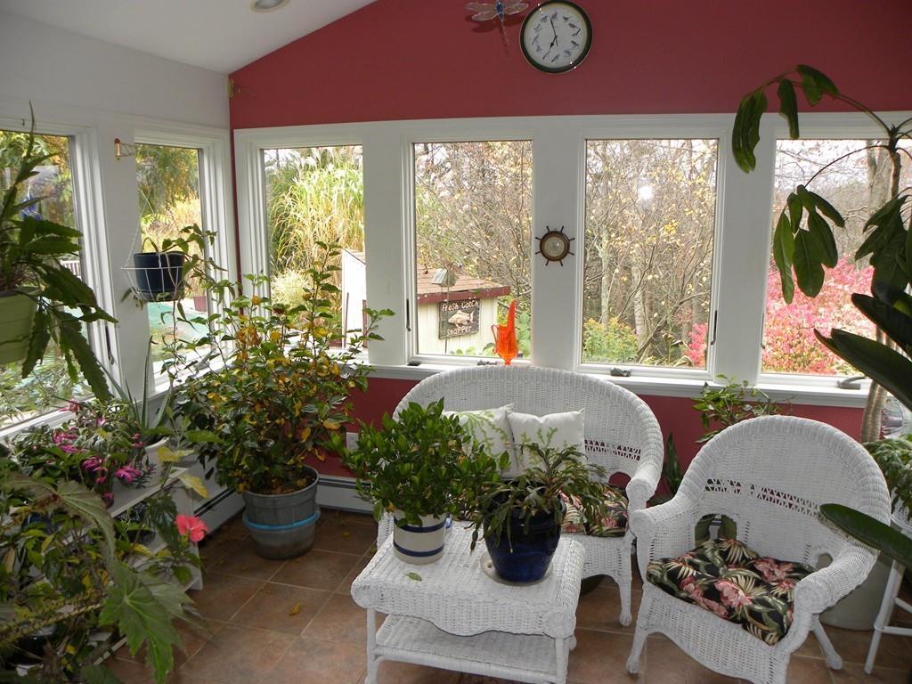 101 Vinton Road Holland, MA 01521 - Photo 18 of 42 a living room filled with furniture and a potted plant