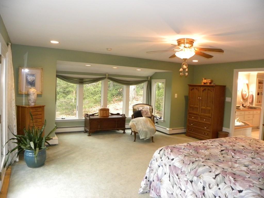 101 Vinton Road Holland, MA 01521 - Photo 20 of 42 a spacious bedroom with a bed and furniture