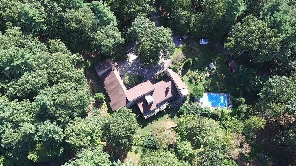 101 Vinton Road Holland, MA 01521 - Photo 30 of 42 an aerial view of a house with a yard and lake view