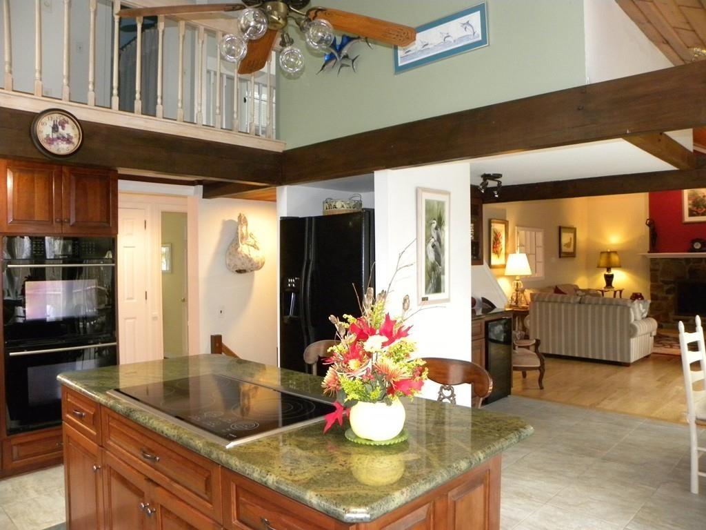 101 Vinton Road Holland, MA 01521 - Photo 3 of 42 a kitchen with a refrigerator and a table