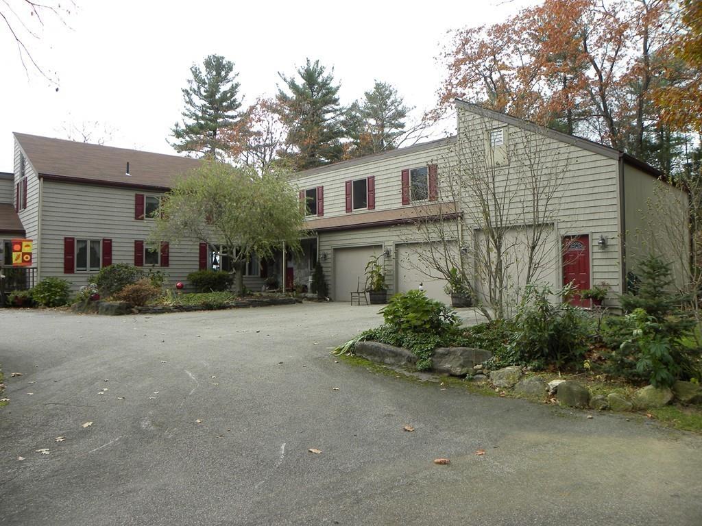 101 Vinton Road Holland, MA 01521 - Photo 38 of 42 a front view of a house with garden