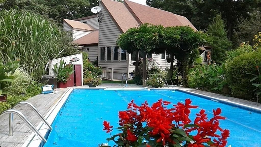 101 Vinton Road Holland, MA 01521 - Photo 4 of 42 a view of a swimming pool with sitting area