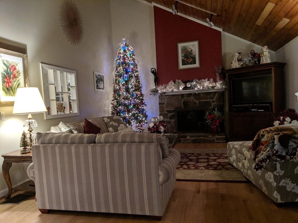 101 Vinton Road Holland, MA 01521 - Photo 5 of 42 a living room with furniture a flat screen tv and a fireplace