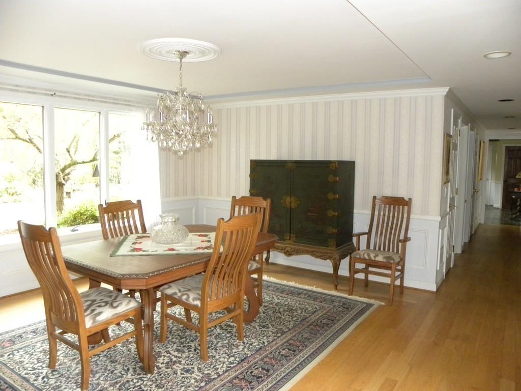 101 Vinton Road Holland, MA 01521 - Photo 8 of 42 a dining room with furniture a chandelier and wooden floor