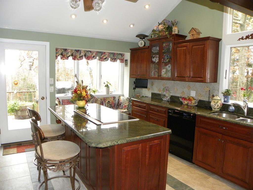 101 Vinton Road Holland, MA 01521 - Photo 10 of 42 a kitchen with a stove a sink and a refrigerator