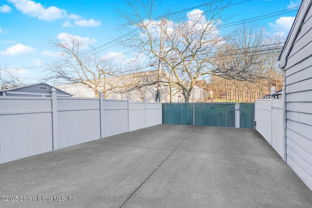 111 Hampton Green Staten Island, NY 10312 - Photo 14 of 19 a view of a backyard of the house