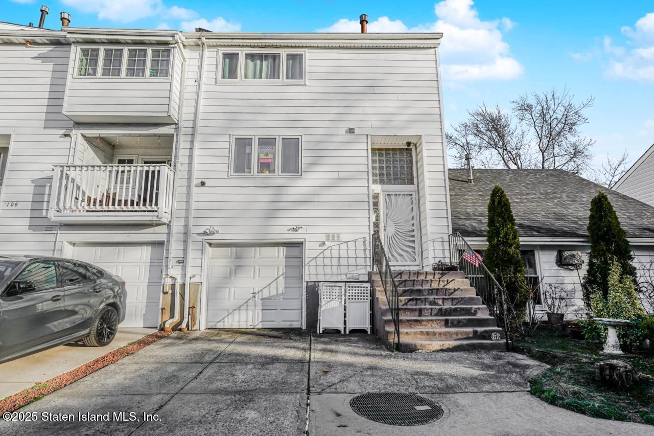 111 Hampton Green Staten Island, NY 10312 - Photo 19 of 19 a front view of a house with stairs